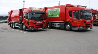 Two red Scania refuse trucks