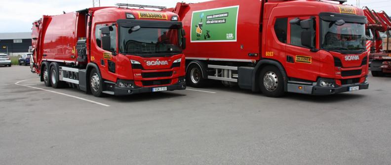 Two red Scania refuse trucks