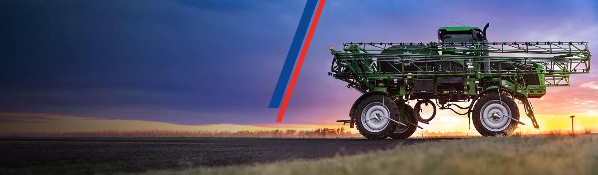 Image of an agriculture sprayer working in a field.