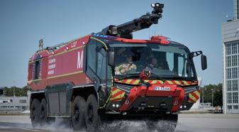 An ARFF equipped with an Allison 4800R travels down a road at the Munich Airport.