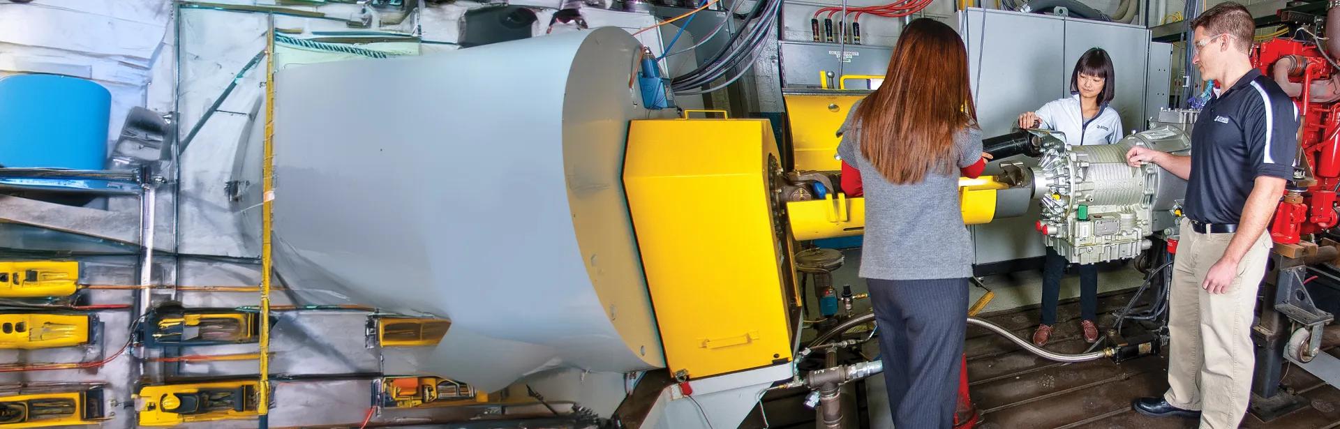 Allison crew members reviewing a transmission 