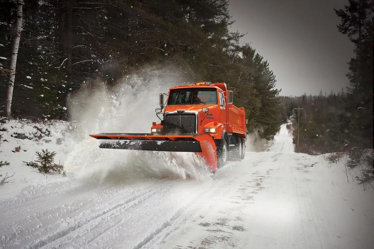 A photo of an orange snowplow truck with an Allison 4000 Series transmission.