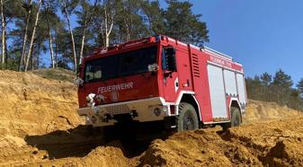 Red forest fire pumper truck in Germany