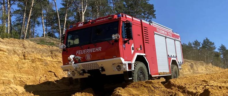 Red forest fire pumper truck in Germany